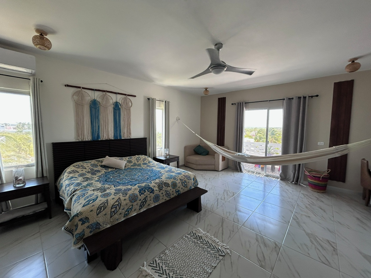 Master bedroom with king bed, hammock and ocean-side terrace